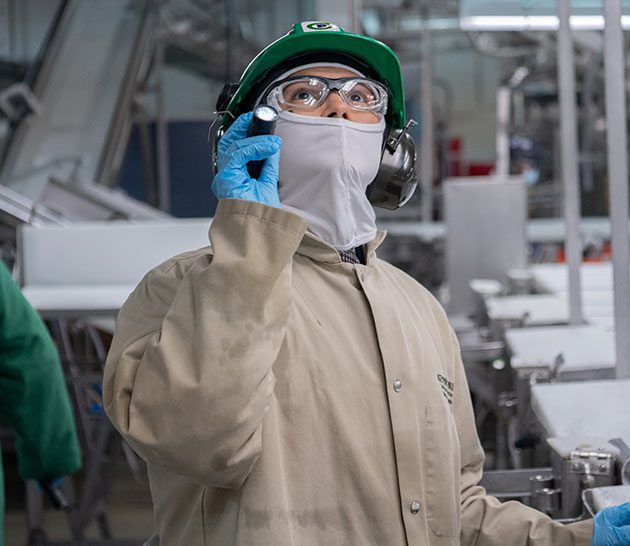 Plant worker inspecting equipment.