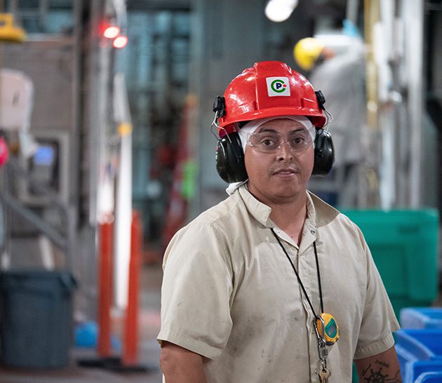 Canada Packers team member with hearing protection.