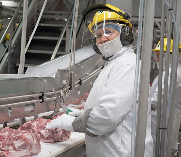 Canada Packers team member working in plant.